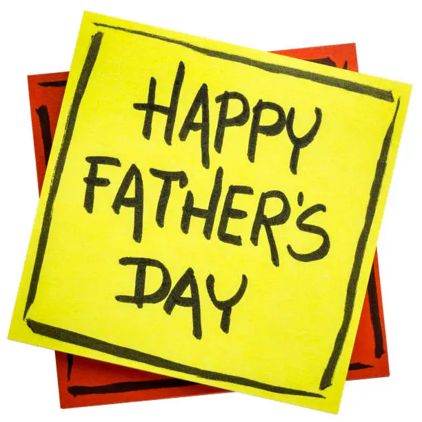 happy father's day - handwriting in black ink on an isolated sticky note