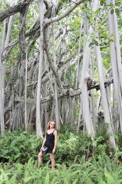 istock Young woman in the tropical rainforest. 697749676