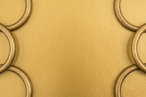 istock metal rings on a golden background 697759444