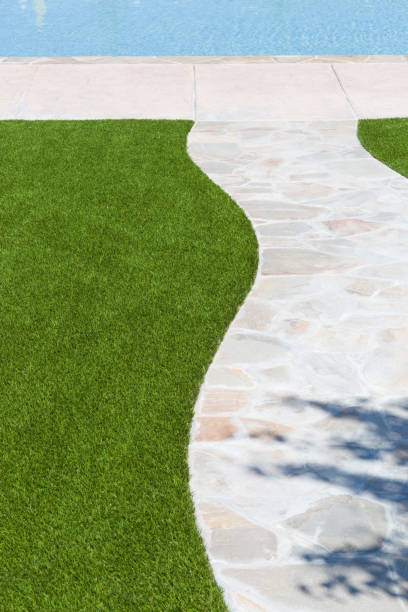 istock New Artificial Grass Installed Near Walkway and Pool. 697762556