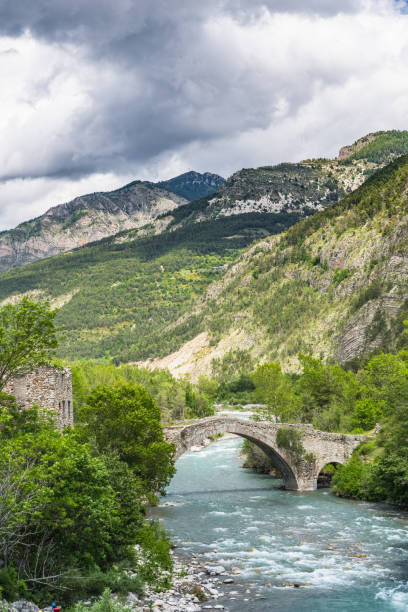 istock Old stone bridge in Apls,France 697768898