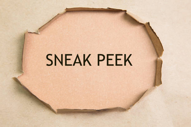 istock The phrase Sneak Peek appearing behind torn brown paper. 697770042