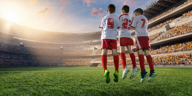 istock Soccer kids player makes a free kick 697770396