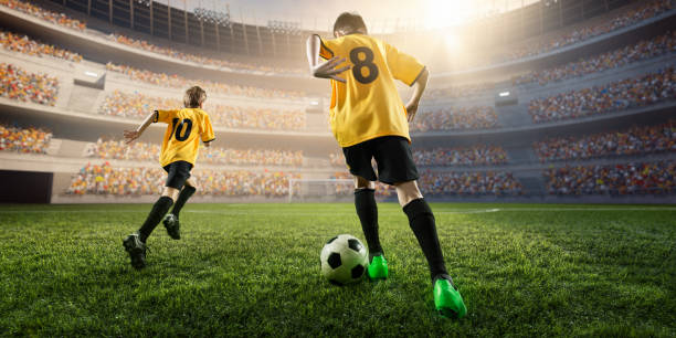 istock Soccer kids players in action 697770432