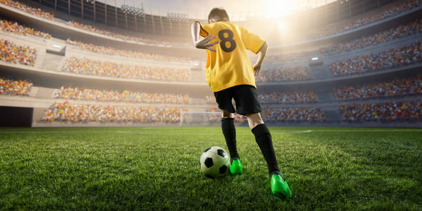 istock Soccer kids player in action in 3D dramatic stadium 697770440