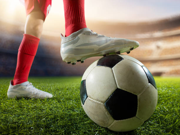 istock Close up soccer kids player with ball 697770448