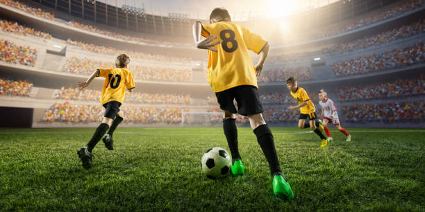 istock Soccer kids players in action 697770450