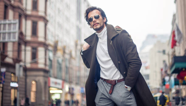 istock Modern man walking in the city with luggage 697773240