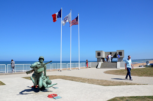 VIERVILLE-SUR-MER, FRANCE - AUG 12:  The 116th Regimental Combat Team Statue and Plaque is shown at Omaha Beach in Vierville-sur-Mer, France on August 12, 2016.