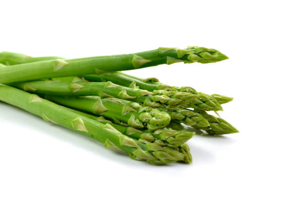 istock Fresh green asparagus on white background 697790870