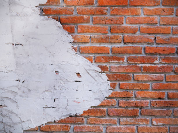 istock Close up dirty brick wall and concrete texture background 697794362