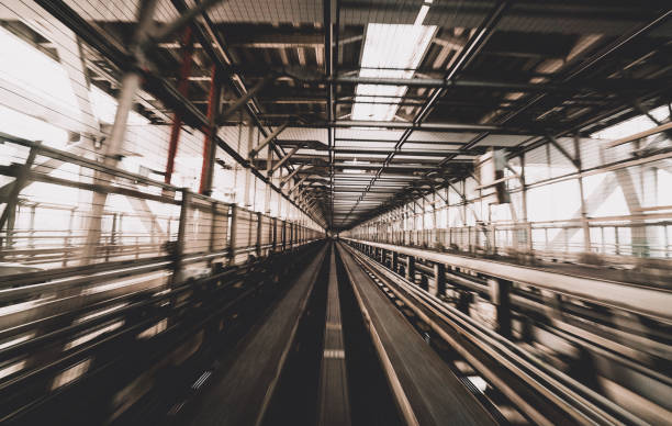 istock Train moving on city rail with motion blur 697797512