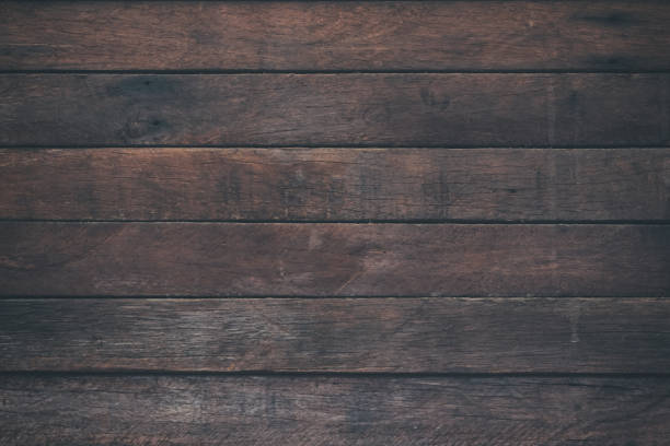 istock Vintage surface wood table and rustic grain texture background. Close up of dark rustic wall made of old wood table planks texture. Rustic brown wood table texture background template for your design. 697800972