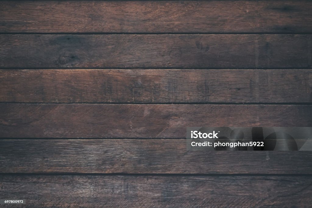 Vintage surface wood table and rustic grain texture background. Close up of dark rustic wall made of old wood table planks texture. Rustic brown wood table texture background template for your design. Wood - Material Stock Photo