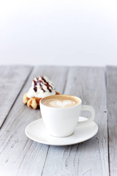 Hot coffee cafe latte with waffle