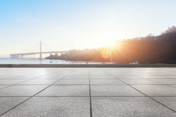 istock empty floor near modern suspension bridge with sunbeam 697805678