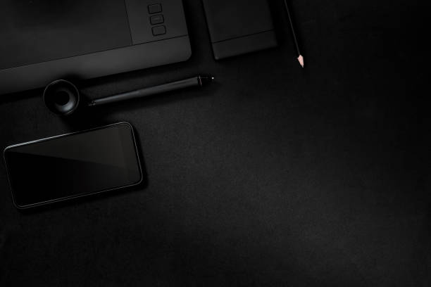 istock Office leather desk table with digital drawing tablet, supplies and smartphone. 697816366