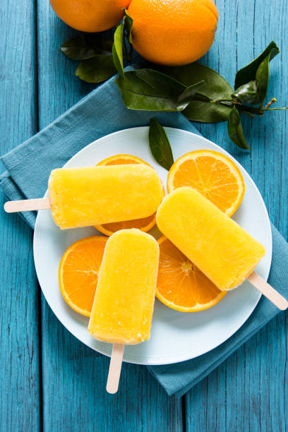 istock Orange juice homemade popsicle 697819230
