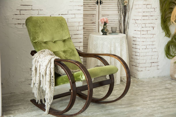 istock Green rocking chair on a background 697823182
