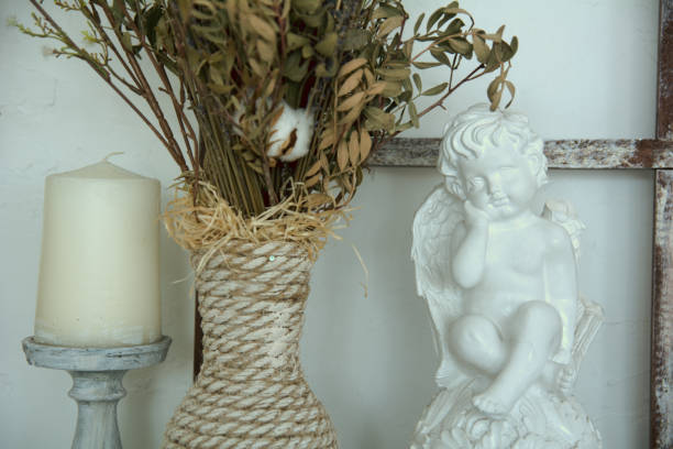 istock Close-up fragment of the interior with ceramic angel, 697823202