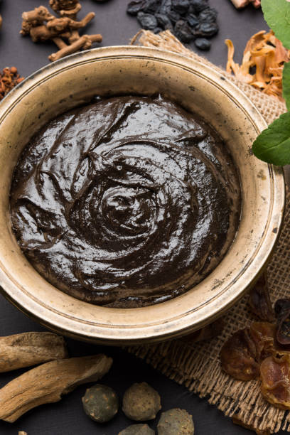 istock Indian Ayurvedic dietary supplement called Chyawanprash / chyavanaprasha  is a cooked mixture of sugar, honey, ghee, Indian Gooseberry (amla), jam, sesame oil, berries, herbs and various spices 697834618
