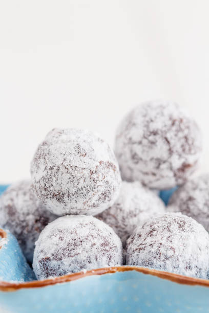 istock Chocolate truffle with sugar powder on white 697842572