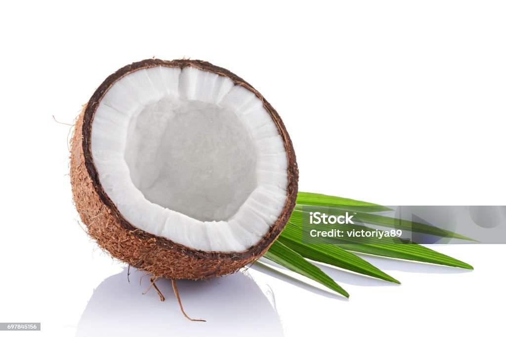 Fresh coconut with green palm leaves Healthy food. Fresh coconut with green palm leaves isolated on white background Coconut Palm Tree Stock Photo