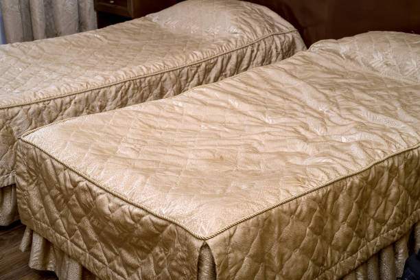 Twin beds in a hotel room close up