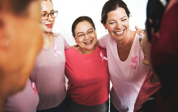 Group of Multiethnic Women Wear Pink Shirt stock photo