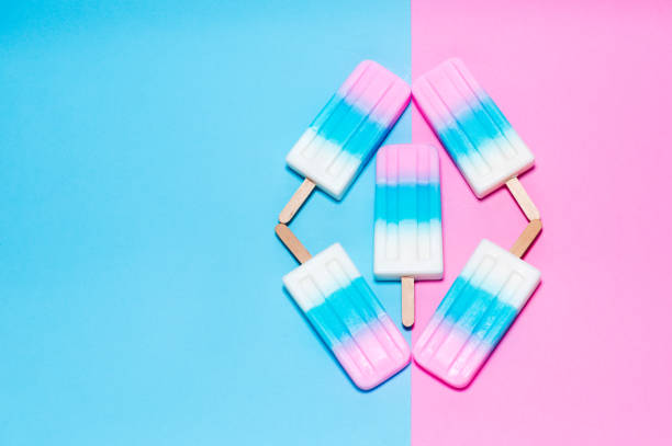 istock ice-cream on pink and blue background 697853512