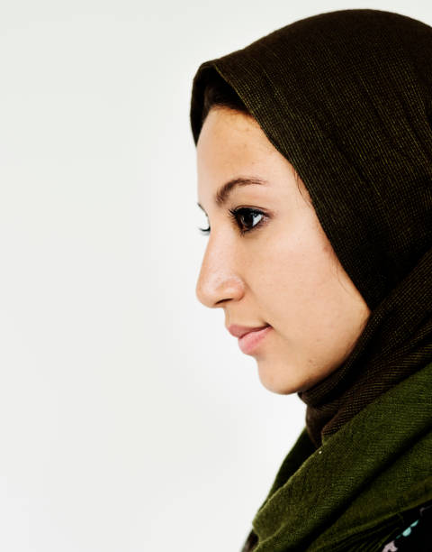istock Adult Woman Serene Face Expression Side Gesture Studio Portrait 697853514