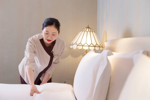 istock woman services in modern bedroom 697856108