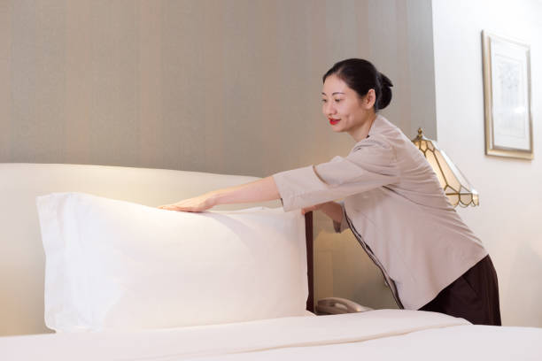 istock woman services in modern bedroom 697856280