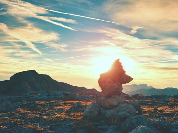 istock Sharp stones stacked at trail run. Heavy pebbles stack on dry grass n at trekking path 697856326