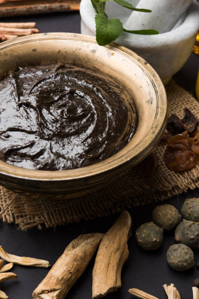 istock Indian Ayurvedic dietary supplement called Chyawanprash / chyavanaprasha  is a cooked mixture of sugar, honey, ghee, Indian Gooseberry (amla), jam, sesame oil, berries, herbs and various spices 697856736