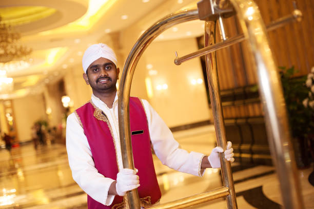 istock young asian porter with cart 697856974