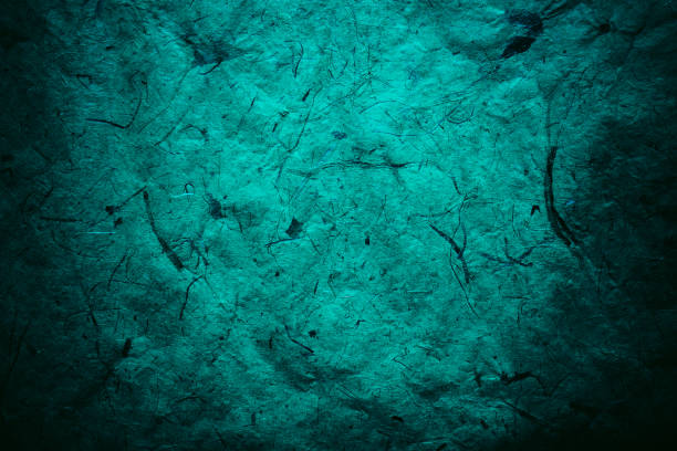 istock Abstract turquoise texture and background for designers. Vintage paper background. Rough turquoise texture of recycled paper. Closeup view of abstract turquoise texture. Vintage blue paper. 697860356