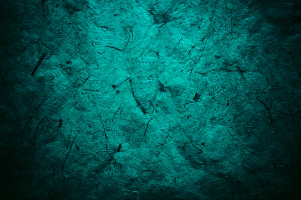 istock Abstract turquoise texture and background for designers. Vintage paper background. Rough turquoise texture of recycled paper. Closeup view of abstract turquoise texture. Vintage blue paper. 697860366