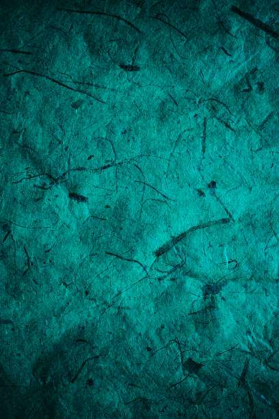 istock Abstract turquoise texture and background for designers. Vintage paper background. Rough turquoise texture of recycled paper. Closeup view of abstract turquoise texture. Vintage blue paper. 697860374