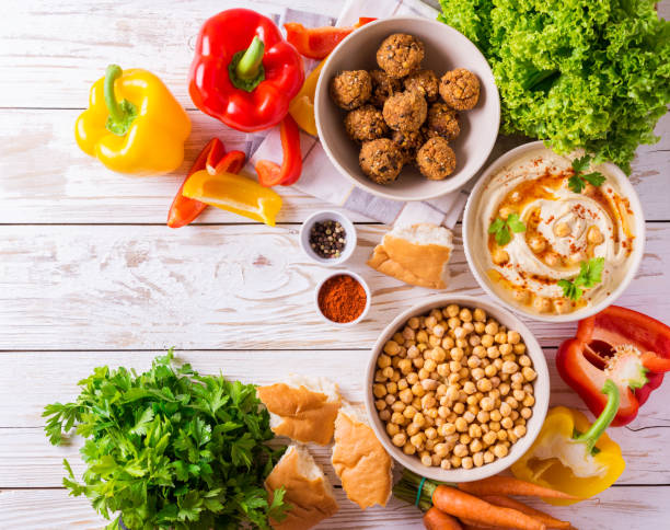 istock Falafel, pita, hummus and chickpea  with vegetables. Top view 697860422