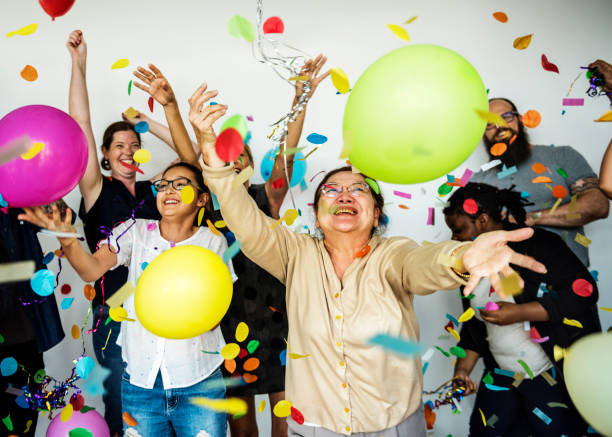 istock Group of Diverse People with Party Balloons Confetti 697860572