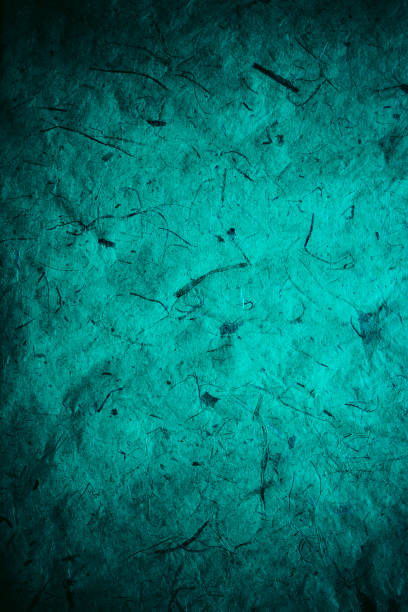 istock Abstract turquoise texture and background for designers. Vintage paper background. Rough turquoise texture of recycled paper. Closeup view of abstract turquoise texture. Vintage blue paper. 697862652
