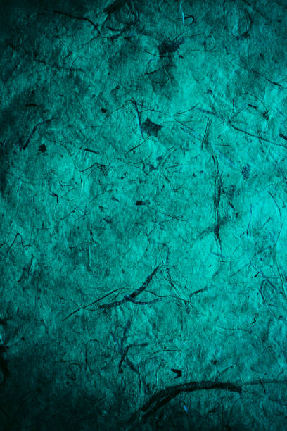 istock Abstract turquoise texture and background for designers. Vintage paper background. Rough turquoise texture of recycled paper. Closeup view of abstract turquoise texture. Vintage blue paper. 697862674