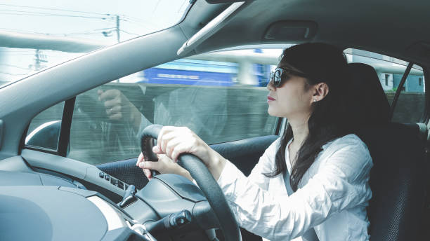 istock Woman driving a car 697862840
