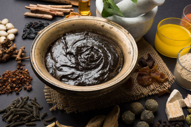 istock Indian Ayurvedic dietary supplement called Chyawanprash / chyavanaprasha  is a cooked mixture of sugar, honey, ghee, Indian Gooseberry (amla), jam, sesame oil, berries, herbs and various spices 697865366