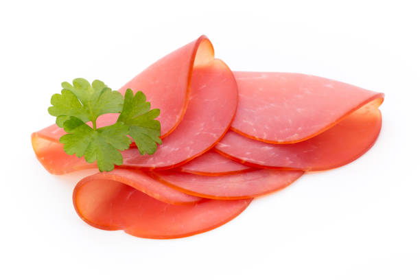 istock Pork ham slices isolated on white background. 697867754
