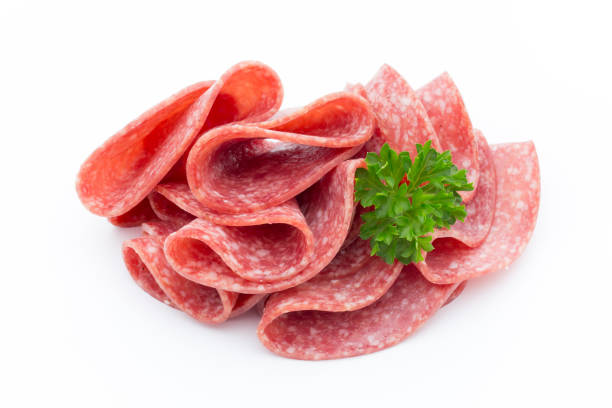 istock Salami sausage slices isolated on white background. 697867926