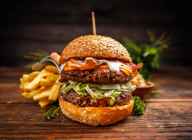istock Delicious burgers with beef patty 697868536