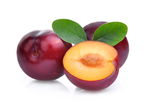 istock red cherry plum, tropical fruit with green leaves isolated on white background 697871610