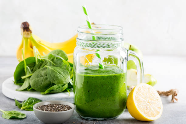 istock Healthy green smoothie with spinach in glass jar 697872530